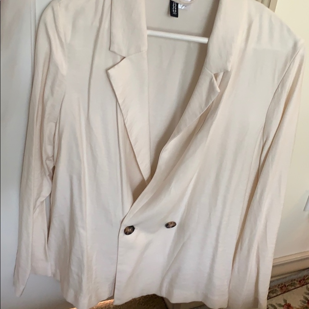 A creamy white suit jacket is on sale now!